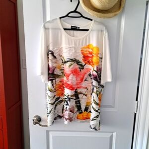 Polyester, tropical print top from Claire France. It has 3/4 sleeves and is size